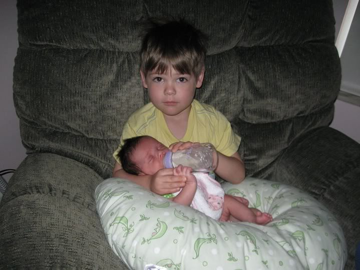 Big Brother feeding Lily