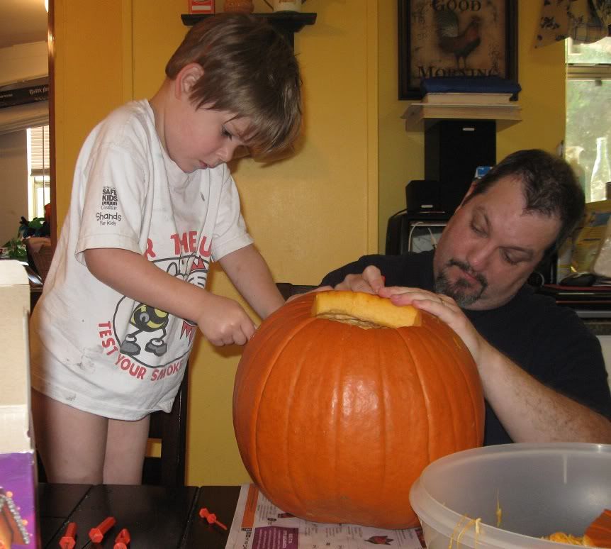 Carving the pumpkin with daddy
