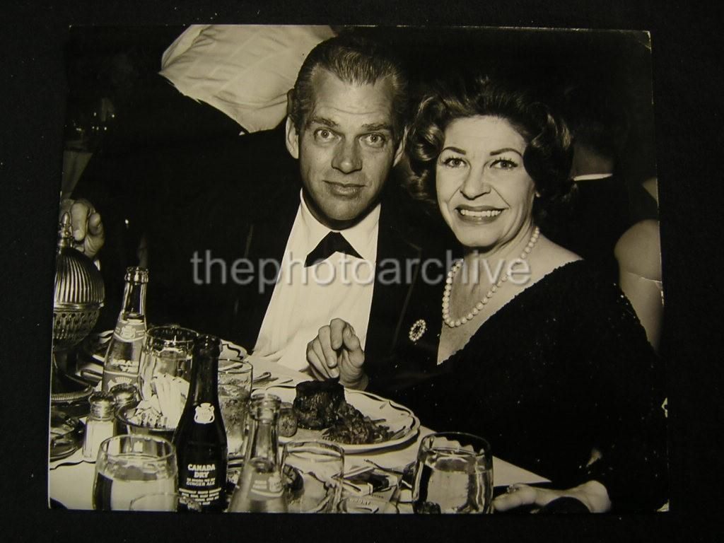 Birthday boy Keith Andes out on the town with comic Martha Raye.